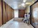 Enclosed sunroom with tile floors, ceiling fan, and ample natural light at 686 Middlebury Loop, New Smyrna Beach, FL 32168