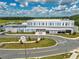 Aerial view showcasing the school building and campus with modern architecture, landscaping, and ample parking at 7223 Sw 61St Pl, Ocala, FL 34474