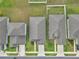 Overhead shot of homes with landscaped yards, driveways, and well maintained roofs at 7223 Sw 61St Pl, Ocala, FL 34474
