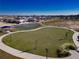Community aerial view featuring green spaces and a basketball court next to beautiful neighborhood homes at 7223 Sw 61St Pl, Ocala, FL 34474