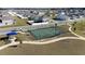 Aerial view of a community basketball court and playground area with sidewalks, and nearby homes in a residential neighborhood at 7223 Sw 61St Pl, Ocala, FL 34474