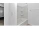 Clean bathroom featuring a tub, neutral color scheme, and modern fixtures, offering functionality at 7223 Sw 61St Pl, Ocala, FL 34474
