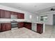 Well-equipped kitchen features modern appliances, granite countertops, and ample cabinet space at 7223 Sw 61St Pl, Ocala, FL 34474