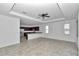 Open concept living area with tile floors connects to modern kitchen at 7223 Sw 61St Pl, Ocala, FL 34474