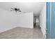 Bright living room featuring tile flooring, a ceiling fan, and an open layout connecting to other spaces at 7223 Sw 61St Pl, Ocala, FL 34474