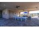 Comfortable covered outdoor lounge featuring stylish seating and ceiling fans for gatherings at 7223 Sw 61St Pl, Ocala, FL 34474