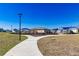 Community playground featuring modern equipment, shaded seating areas, and a winding sidewalk for families to enjoy outdoor activities at 7223 Sw 61St Pl, Ocala, FL 34474