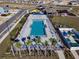 Aerial view of a resort-style swimming pool with lounge chairs and lush landscaping at 7223 Sw 61St Pl, Ocala, FL 34474