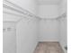 Spacious walk-in closet with tile floor, upper shelving for storage and organization at 7223 Sw 61St Pl, Ocala, FL 34474