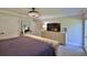 Bedroom showcasing a comfortable bed, a large dresser, and soft carpet, creating a relaxing retreat at 798 Fairway Dr, New Smyrna Beach, FL 32168