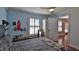 Sunlit bedroom with dark hardwood floors and a view to other rooms at 798 Fairway Dr, New Smyrna Beach, FL 32168