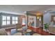 Bright dining room with hardwood floors and a view into other rooms at 798 Fairway Dr, New Smyrna Beach, FL 32168