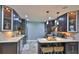 Spacious kitchen with dark wood cabinetry, stainless steel appliances, and a functional center island at 798 Fairway Dr, New Smyrna Beach, FL 32168