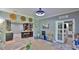 Open-concept living room adjacent to kitchen and Gathering room with custom barrel head wall decor at 798 Fairway Dr, New Smyrna Beach, FL 32168