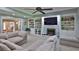 Cozy living room with custom built-in shelving and fireplace, perfect for entertaining at 798 Fairway Dr, New Smyrna Beach, FL 32168