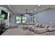 Comfortable living room featuring a large sectional sofa and abundant natural light at 798 Fairway Dr, New Smyrna Beach, FL 32168