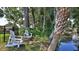 Scenic backyard with a calm waterfront, featuring waterfront seating, creating a tranquil setting at 798 Fairway Dr, New Smyrna Beach, FL 32168
