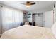 This bedroom features a ceiling fan, desk, and closet at 903 Conrad Dr, New Smyrna Beach, FL 32168