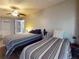 Bedroom featuring two beds and a ceiling fan at 903 Conrad Dr, New Smyrna Beach, FL 32168