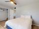 Bright bedroom features a closet, window, and neutral colored walls at 903 Conrad Dr, New Smyrna Beach, FL 32168