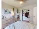 Bright bedroom with a ceiling fan, window, closet, and dresser at 903 Conrad Dr, New Smyrna Beach, FL 32168