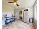 Bright kitchen features stainless steel appliances, wood floors, modern lighting, and a breakfast bar seating area at 903 Conrad Dr, New Smyrna Beach, FL 32168