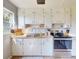 Bright kitchen with white cabinets and modern appliances at 903 Conrad Dr, New Smyrna Beach, FL 32168