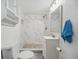 Modern bathroom with marble tiled shower, sleek vanity, and contemporary fixtures at 934 N Halifax Ave, Daytona Beach, FL 32118
