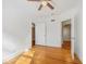 This bedroom has hardwood floors, white walls and trim, and multiple doorways at 934 N Halifax Ave, Daytona Beach, FL 32118