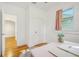Bright bedroom featuring hardwood floors, a window and a desk at 934 N Halifax Ave, Daytona Beach, FL 32118