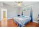 Bright bedroom with hardwood floors, ceiling fan, and soothing blue accents at 934 N Halifax Ave, Daytona Beach, FL 32118