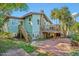 Charming home with a deck, landscaped yard, and a beautiful stone chimney at 934 N Halifax Ave, Daytona Beach, FL 32118