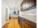 Charming hallway featuring wood floors, arched doorways, and white trim at 934 N Halifax Ave, Daytona Beach, FL 32118