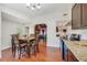 Well-equipped kitchen with granite countertops, dining area, and seamless flow to living spaces at 934 N Halifax Ave, Daytona Beach, FL 32118