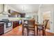 Spacious kitchen featuring dark wood cabinets, modern appliances, and dining area at 934 N Halifax Ave, Daytona Beach, FL 32118