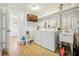 Functional laundry room with washer, dryer, and utility sink at 934 N Halifax Ave, Daytona Beach, FL 32118
