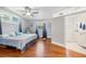 Comfortable main bedroom with a ceiling fan and an en suite bathroom at 934 N Halifax Ave, Daytona Beach, FL 32118