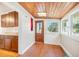 Sun room featuring a wooden ceiling, windows and hardwood floors at 934 N Halifax Ave, Daytona Beach, FL 32118