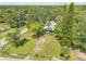 Aerial view of the property showcasing its expansive surroundings at 102 N Brooks Cir, Oak Hill, FL 32759