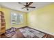Bedroom with hardwood floors and plenty of sunlight at 102 N Brooks Cir, Oak Hill, FL 32759