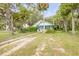 Home with inviting front yard and lush landscaping at 102 N Brooks Cir, Oak Hill, FL 32759