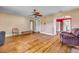 Bright living room featuring hardwood floors and lots of natural light at 102 N Brooks Cir, Oak Hill, FL 32759