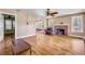 Spacious living room with hardwood floors, fireplace, and lots of natural light at 102 N Brooks Cir, Oak Hill, FL 32759