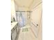 Clean bathroom with tiled floors, single vanity and a glass enclosed shower with a curtain at 103 Old Mill Pond Rd, Edgewater, FL 32141