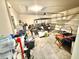 Spacious garage offers ample storage space and room for parking your golf cart or other vehicles at 103 Old Mill Pond Rd, Edgewater, FL 32141