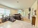Spacious living room with lots of natural light, neutral paint, and tile floors at 103 Old Mill Pond Rd, Edgewater, FL 32141