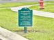 Green Neighborhood Watch sign, warning against loitering and soliciting, ensuring community safety at 103 Old Mill Pond Rd, Edgewater, FL 32141