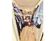 Well-organized walk-in closet with shelving and rods for ample storage at 103 Old Mill Pond Rd, Edgewater, FL 32141