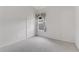 Cozy bedroom with neutral carpet, a double door closet, and a window with floral curtains at 1221 Siesta Key Cir, Port Orange, FL 32128