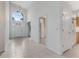 Bright foyer with tile flooring, high ceilings, and white front door at 1221 Siesta Key Cir, Port Orange, FL 32128